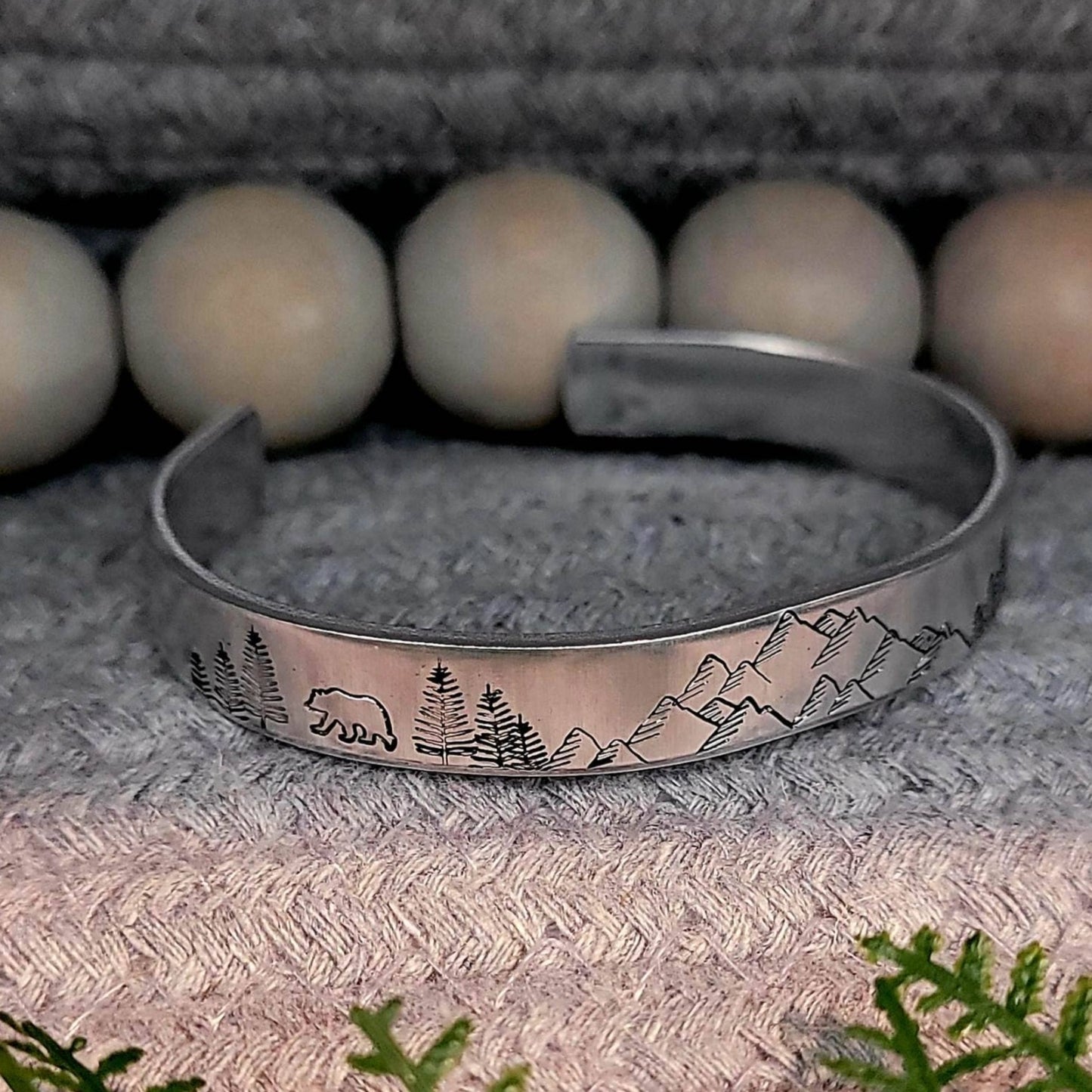 Hand stamped mountain scene aluminum cuff