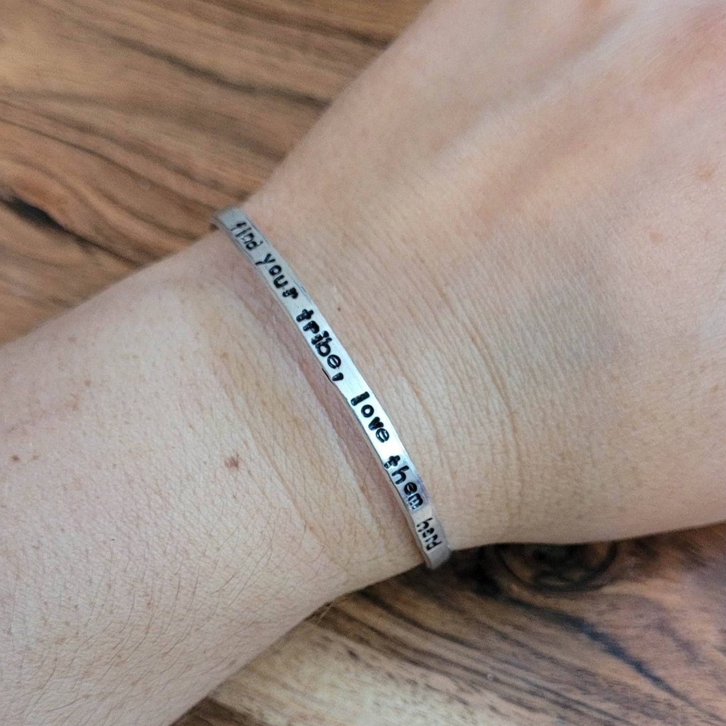 Hand stamped find your tribe, love them hard aluminum cuff