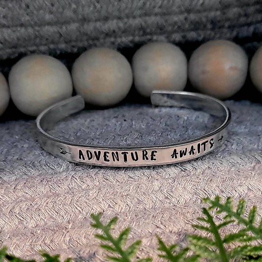 Hand stamped adventure awaits aluminum cuff