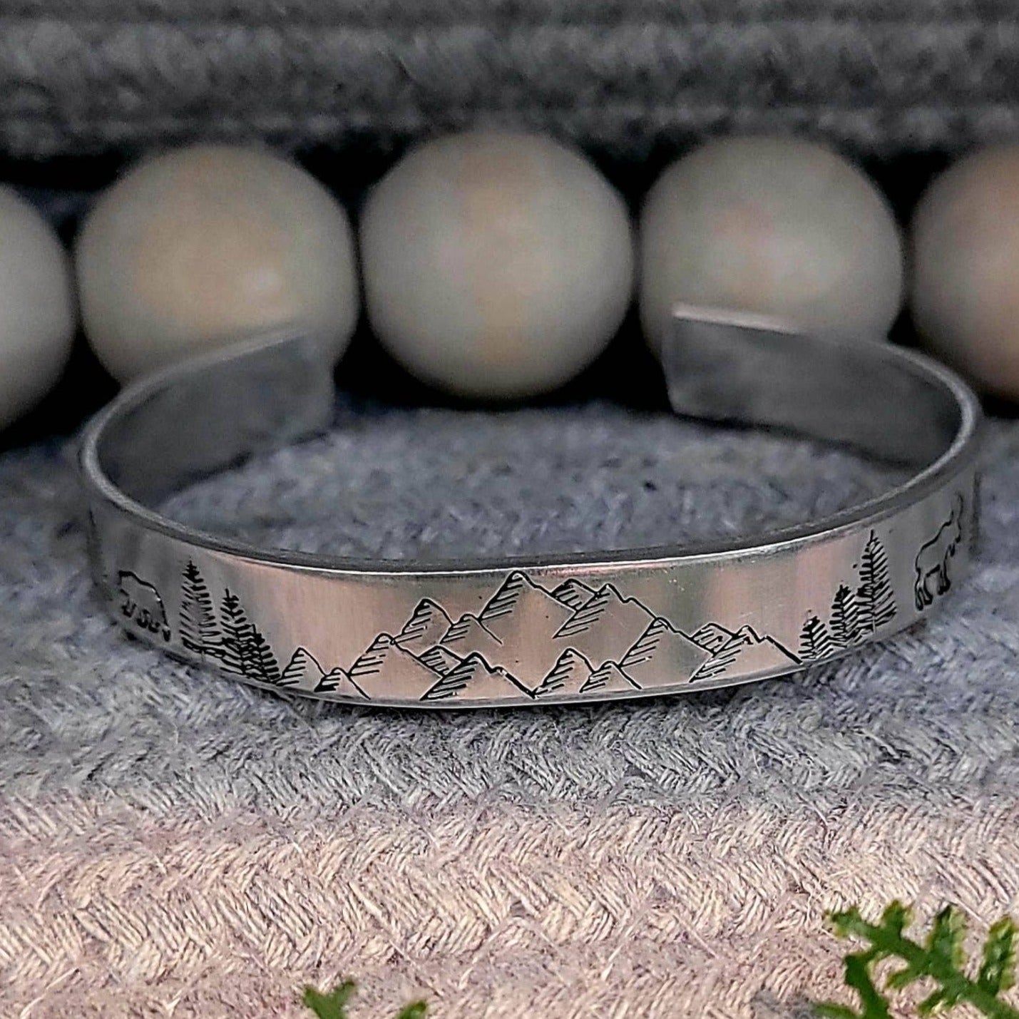 Hand stamped mountain scene aluminum cuff