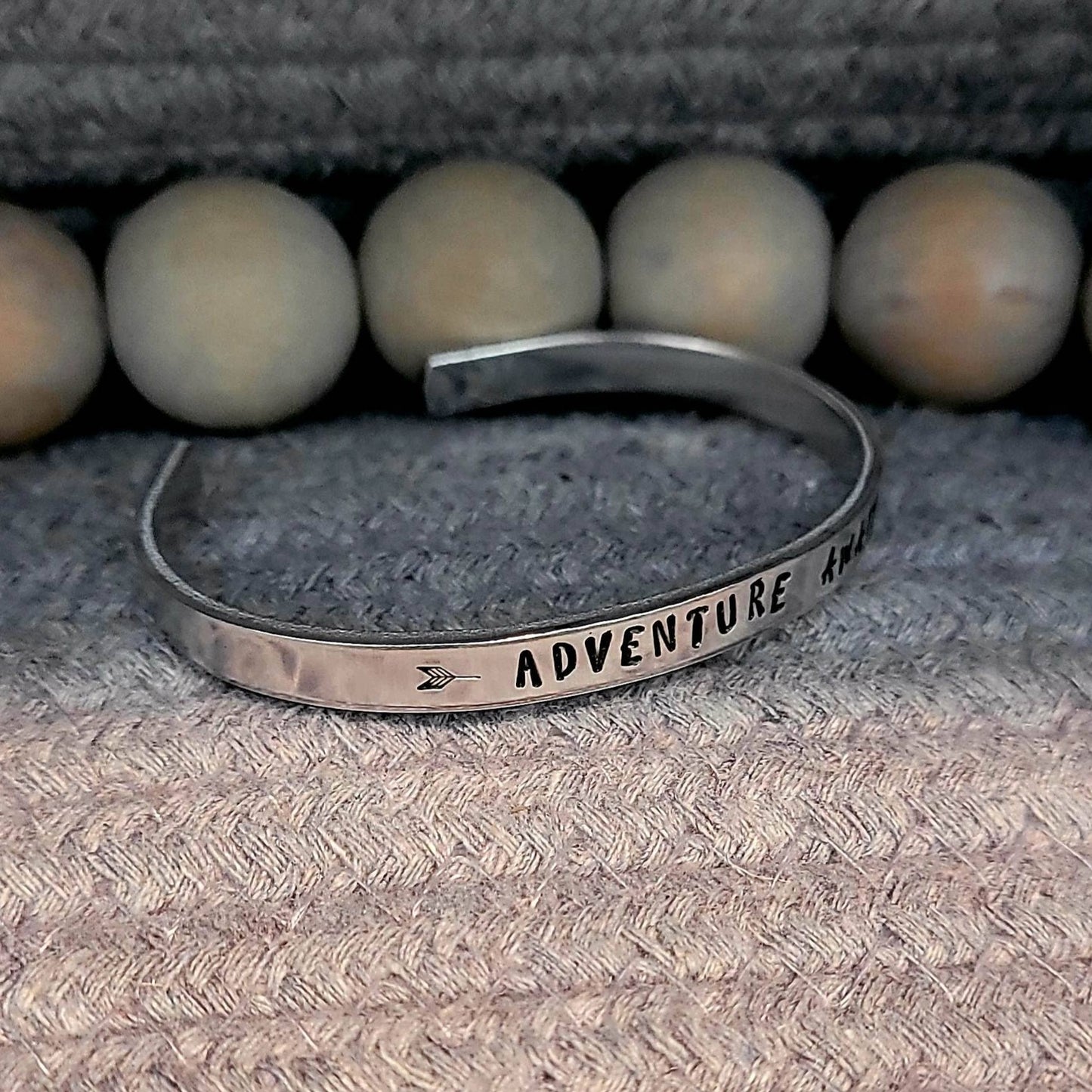 Hand stamped adventure awaits aluminum cuff